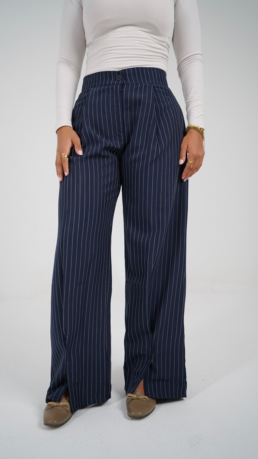 The Navy Pinstripe Pants, front, showing the hem slits