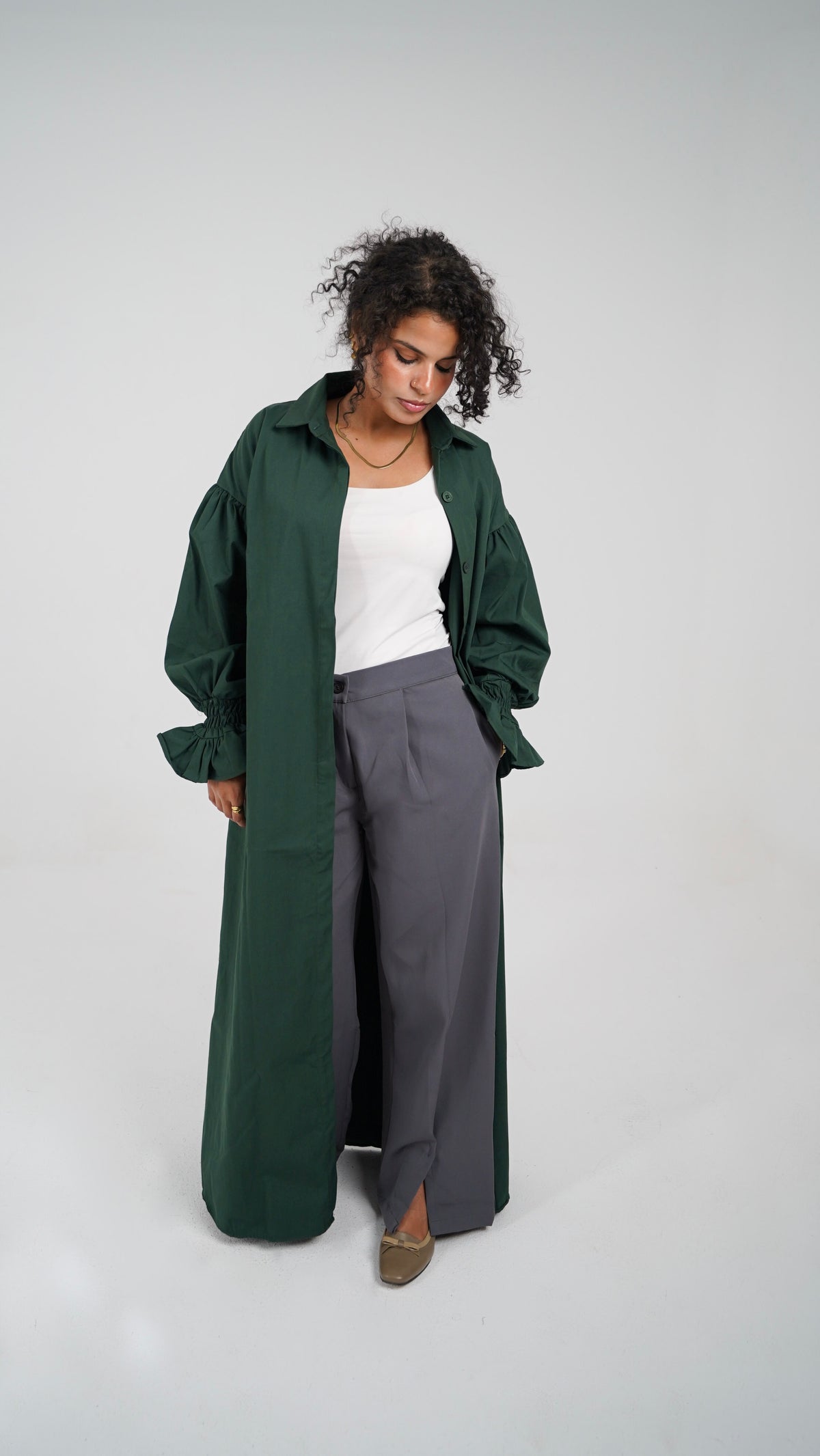 The Olive Dress worn open over The Everyday Pants in grey